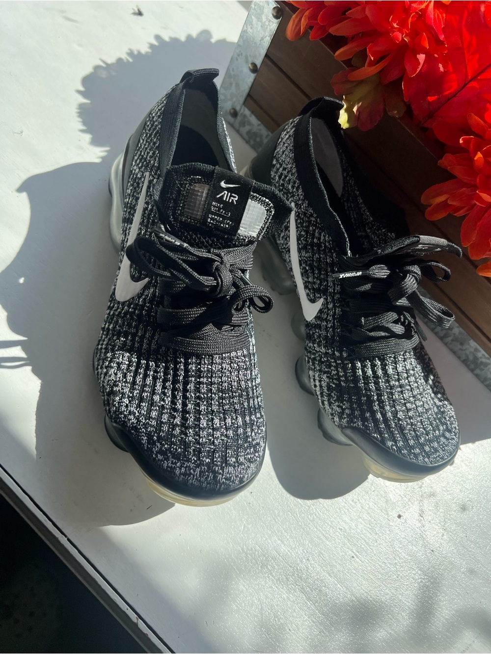 Nike Women's Black and White Flyknit Sneakers